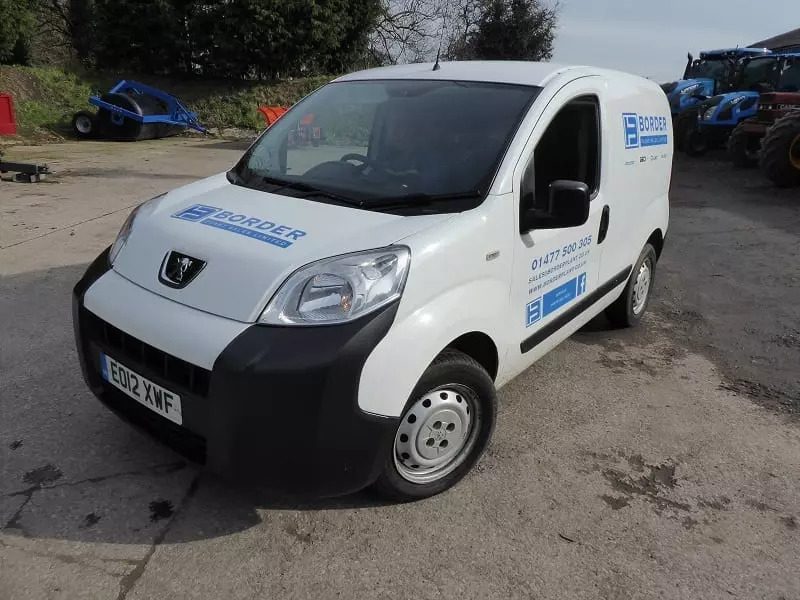 A parked white van.