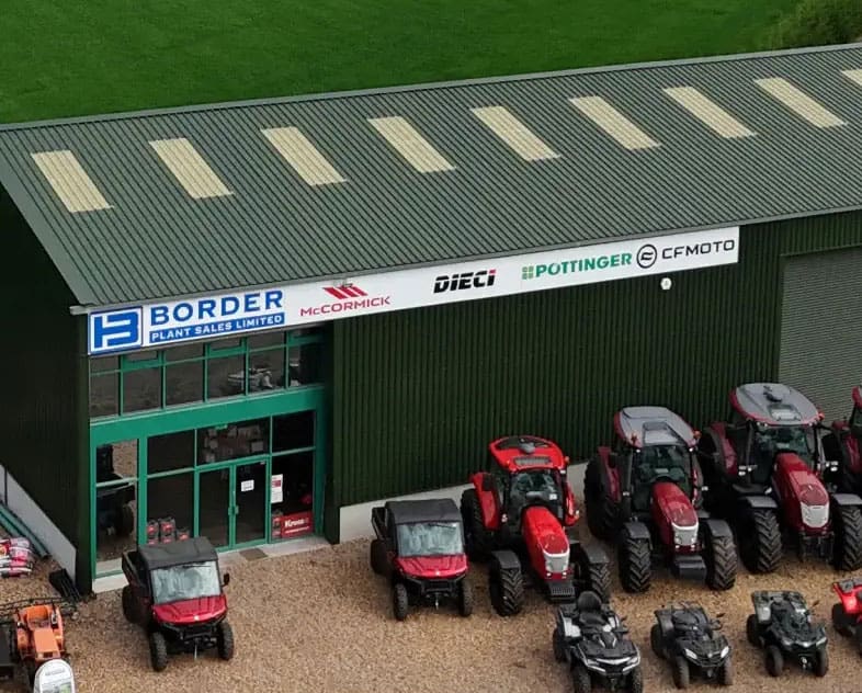 Border Plant Sales Limited building with tractors and agricultural machinery displayed outside.